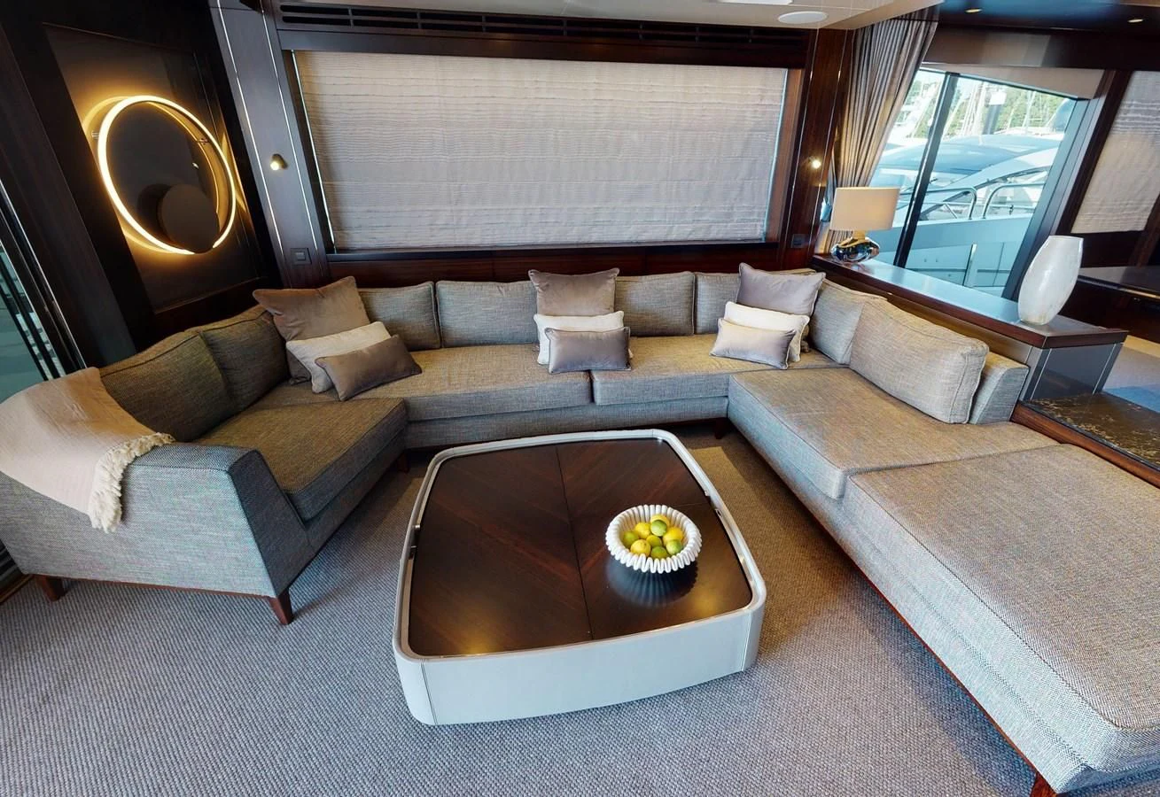 a living room with a couch and a coffee table aboard 88 YACHT Yacht for Sale