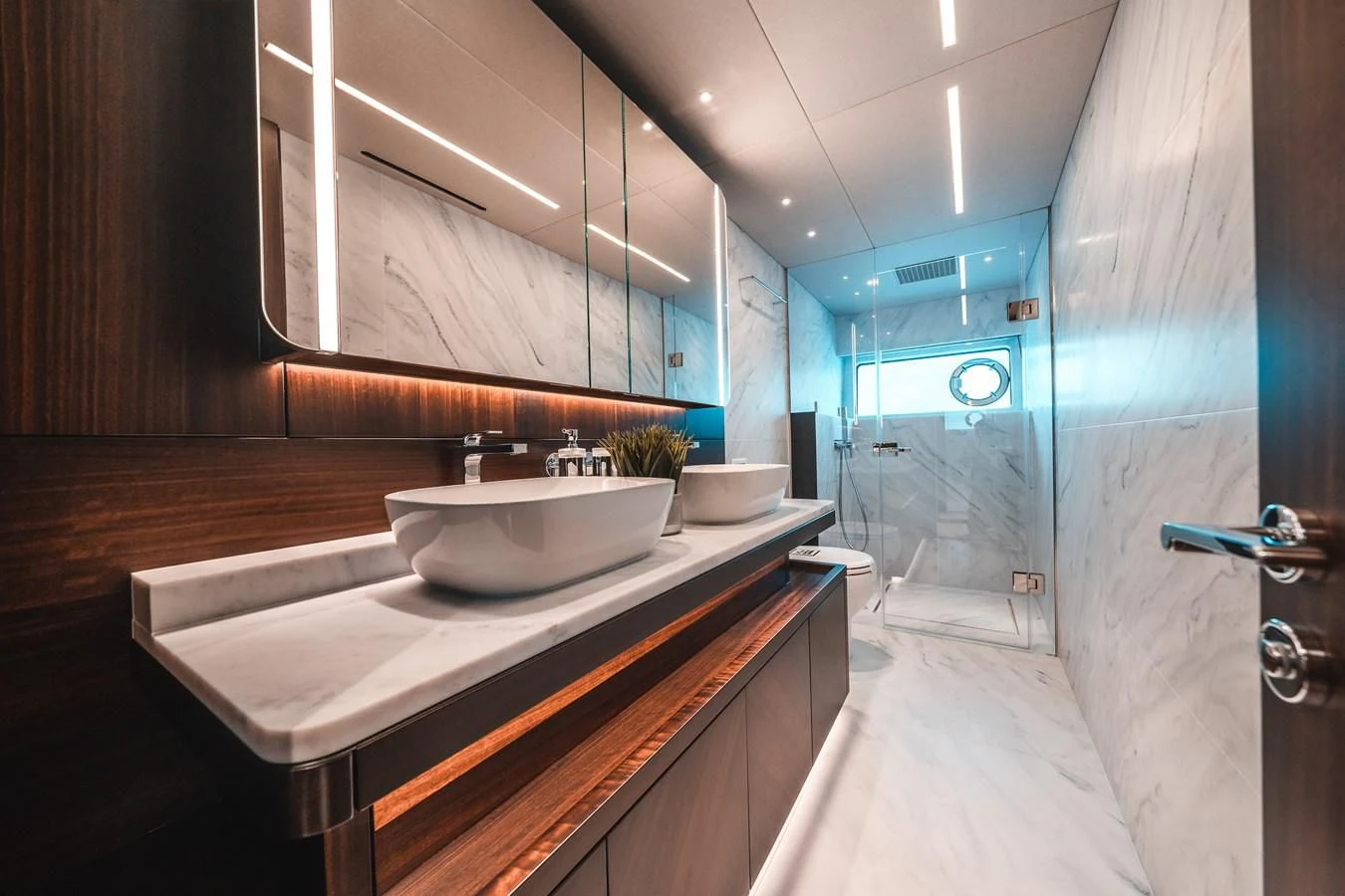 a bathroom with a sink and a mirror aboard 88 YACHT Yacht for Sale