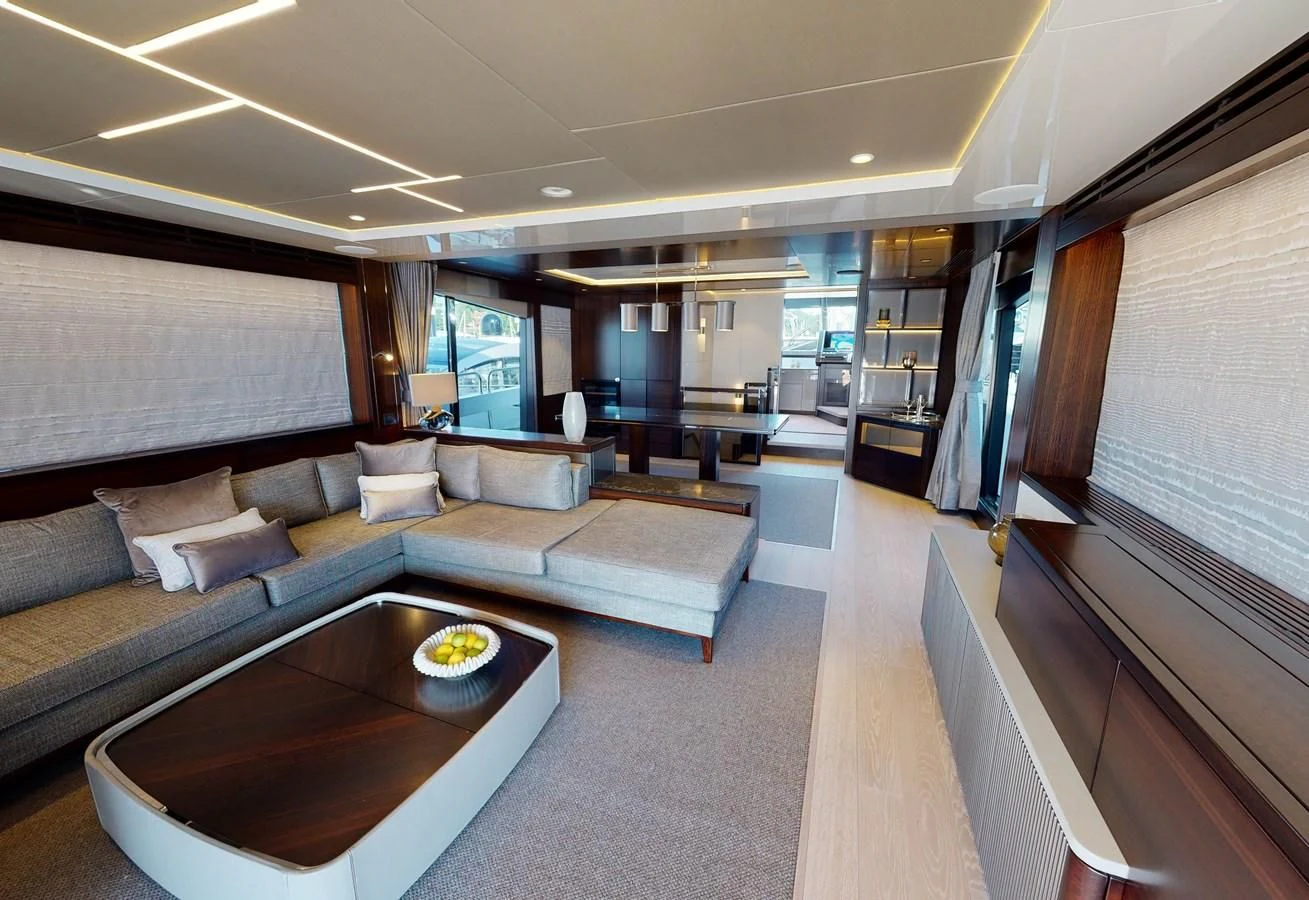a living room with a couch and a coffee table aboard 88 YACHT Yacht for Sale