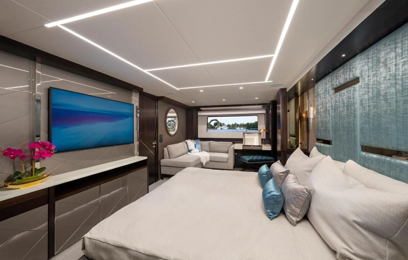 a living room with a large flat screen television and a table aboard 88 YACHT Yacht for Sale