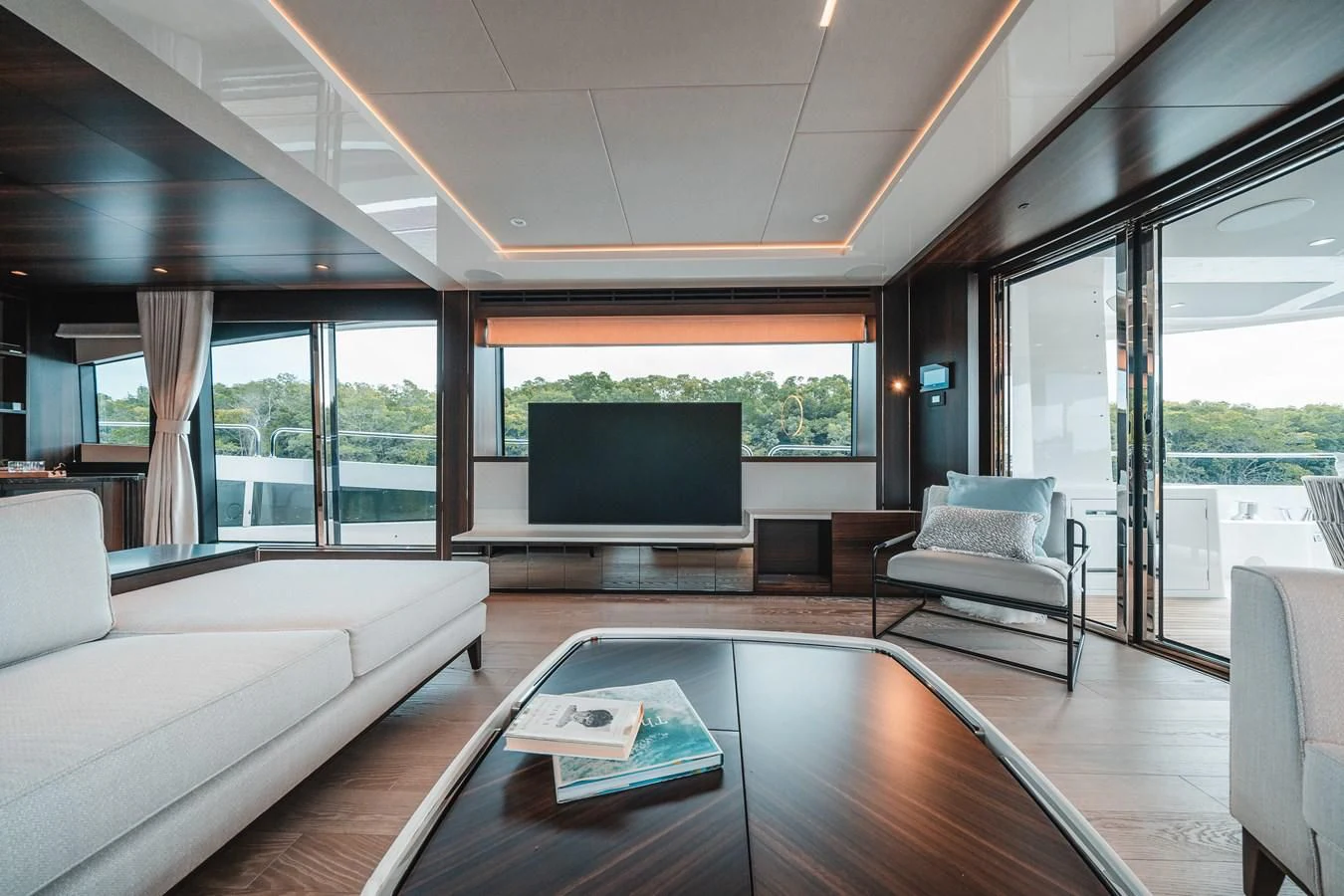 a living room with a large screen aboard 88 YACHT Yacht for Sale