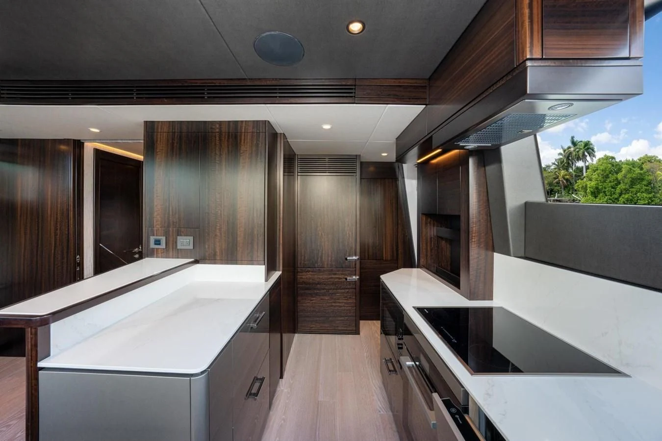 a kitchen with wooden cabinets aboard 88 YACHT Yacht for Sale