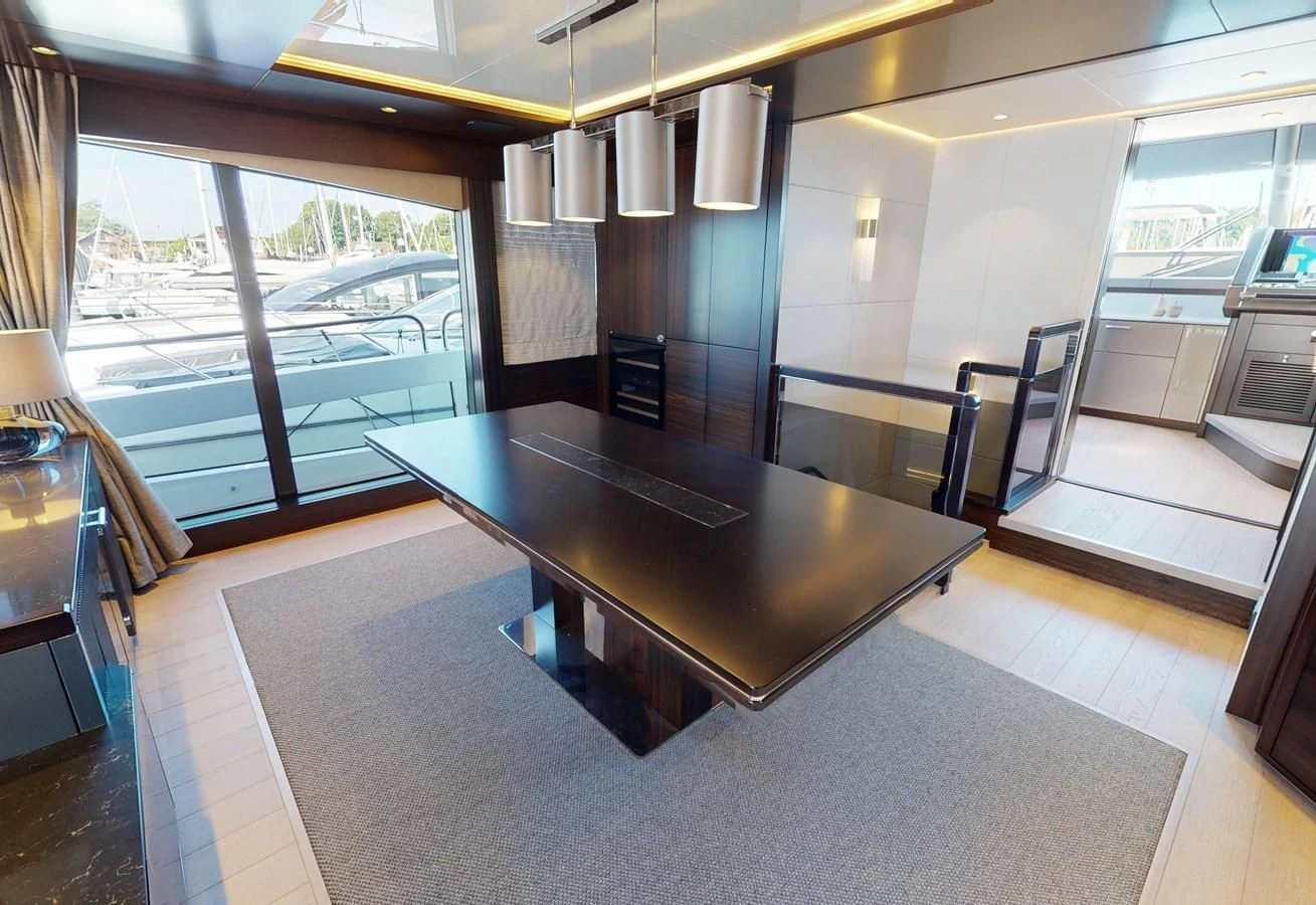 a large room with a table and chairs aboard 88 YACHT Yacht for Sale