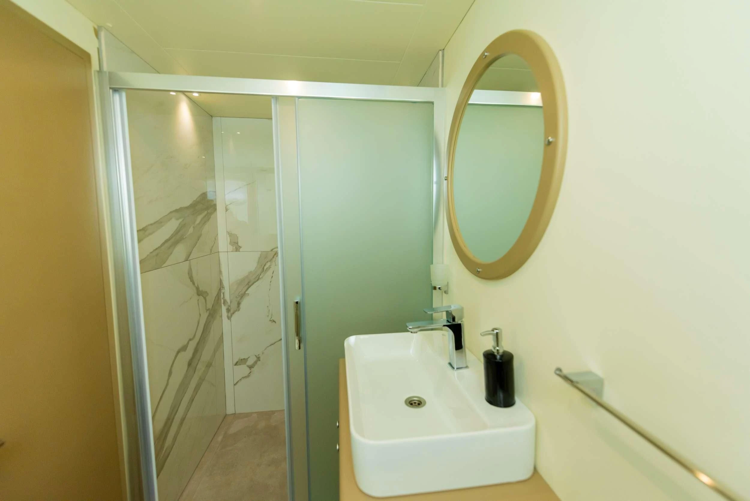 a bathroom with a sink and a mirror aboard 88 YACHT Yacht for Sale