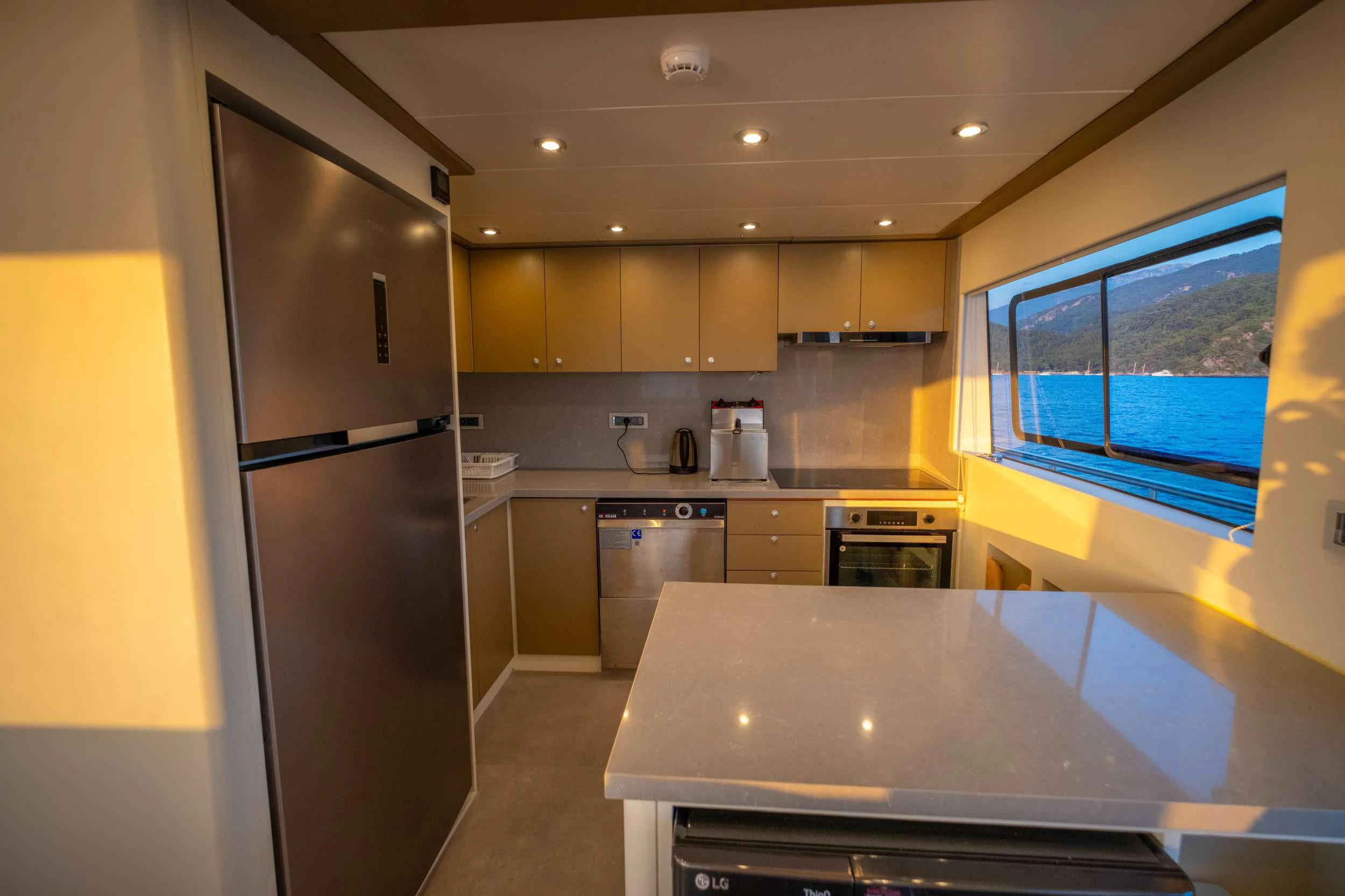 a kitchen with a refrigerator and a microwave aboard 88 YACHT Yacht for Sale