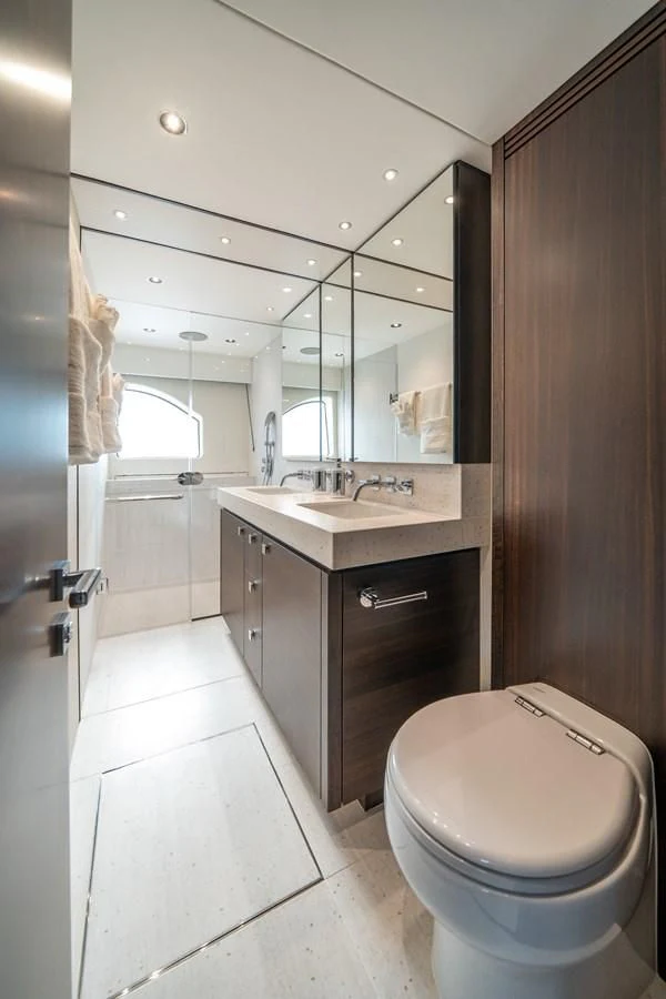 a bathroom with a toilet and sink aboard 88 YACHT Yacht for Sale