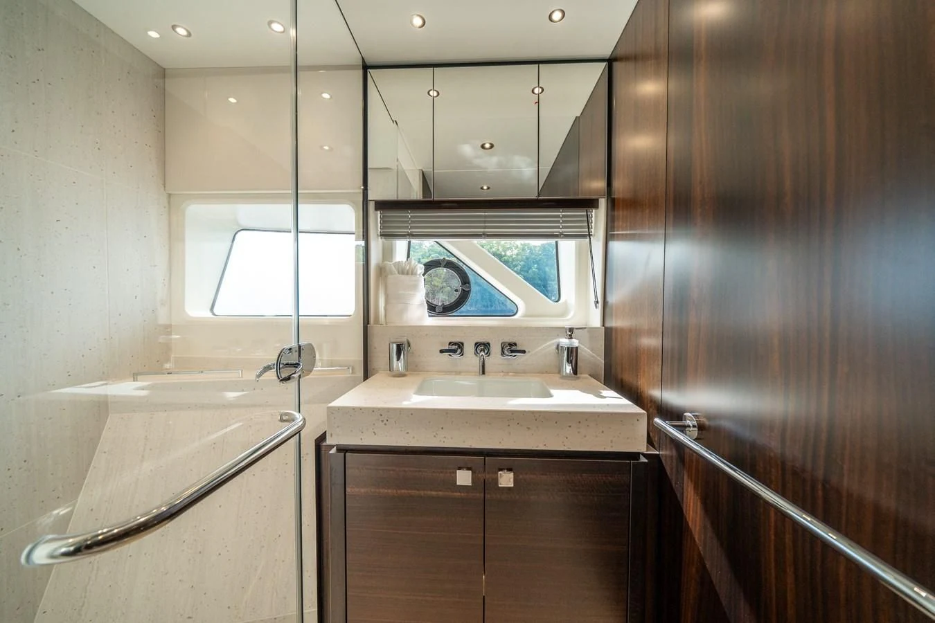 a bathroom with a sink and a mirror aboard 88 YACHT Yacht for Sale
