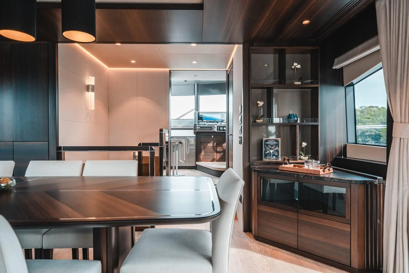 a kitchen with a table and chairs aboard 88 YACHT Yacht for Sale
