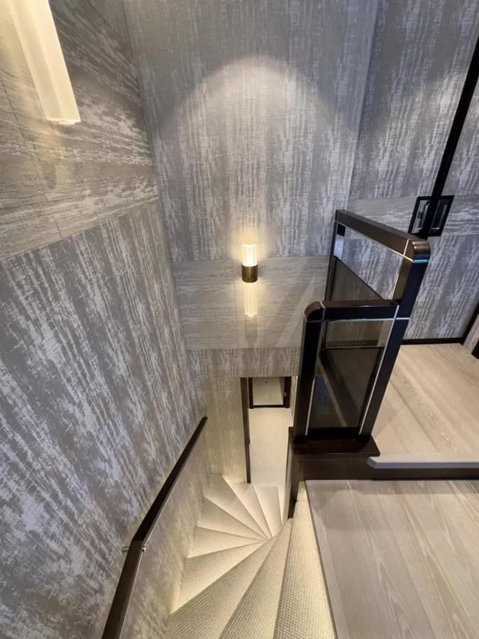 a staircase with a table and a lamp on it aboard 88 YACHT Yacht for Sale