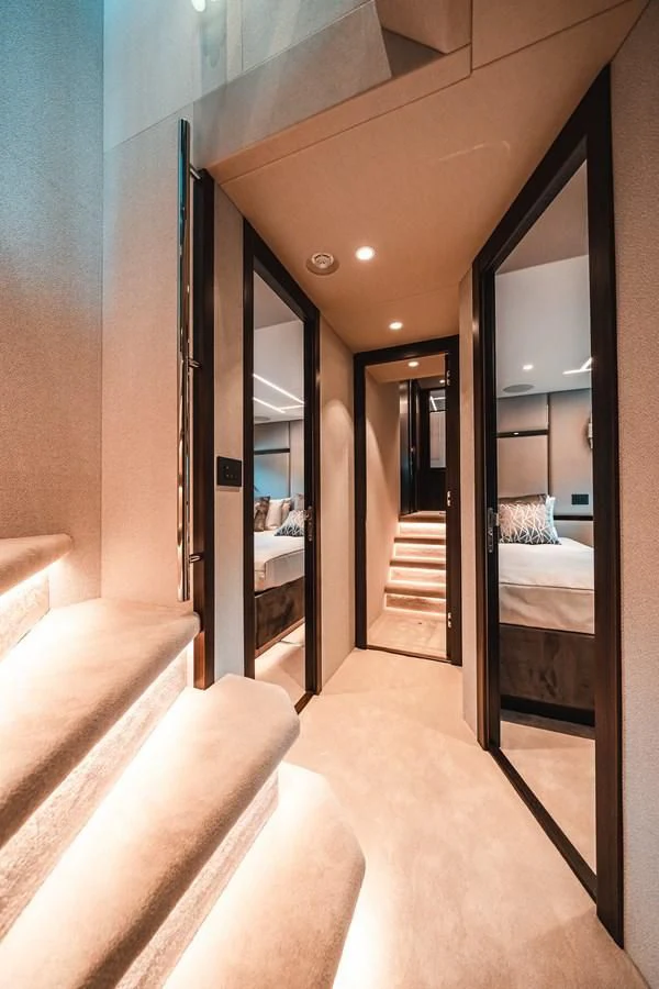 a hallway with a bed and a door aboard 88 YACHT Yacht for Sale