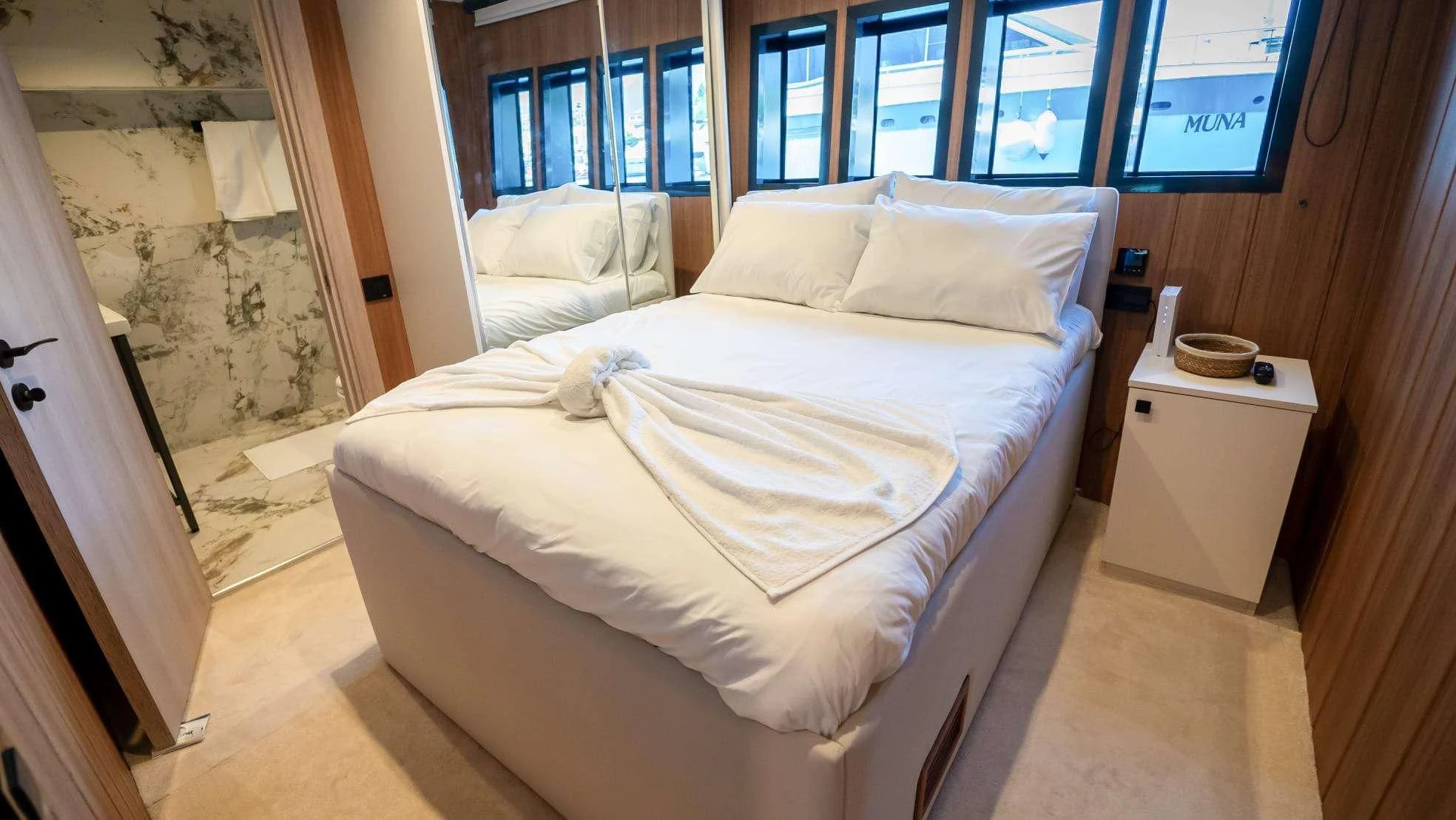 a room with a bed and a mirror aboard 88 YACHT Yacht for Sale