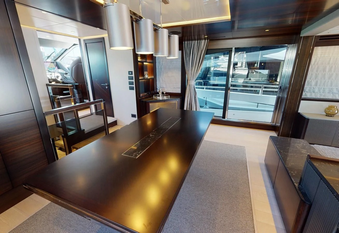 a kitchen with a bar and a table aboard 88 YACHT Yacht for Sale