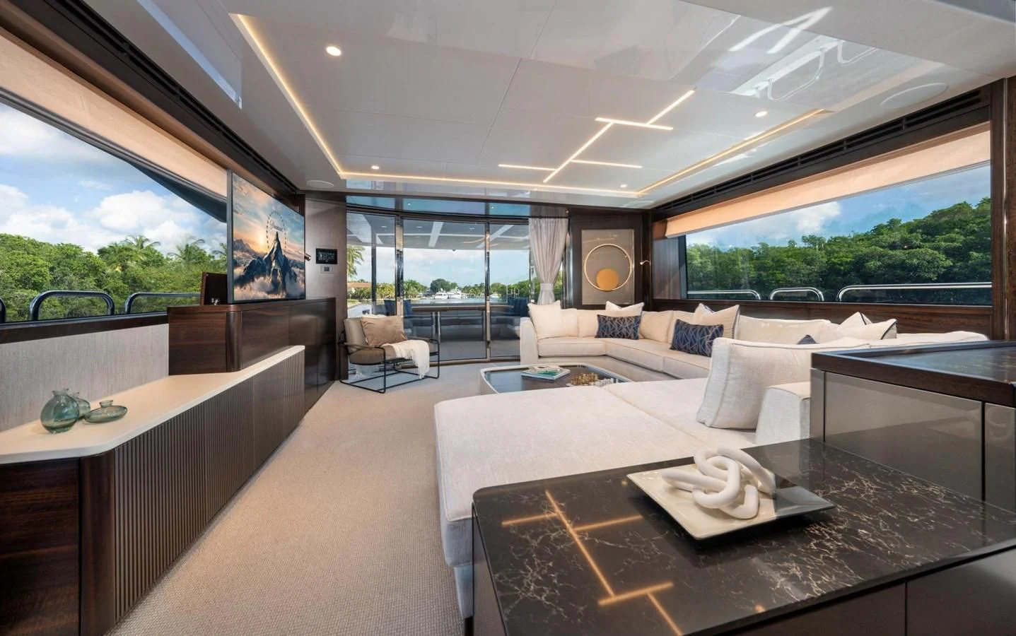 a modern living room with a large window aboard 88 YACHT Yacht for Sale