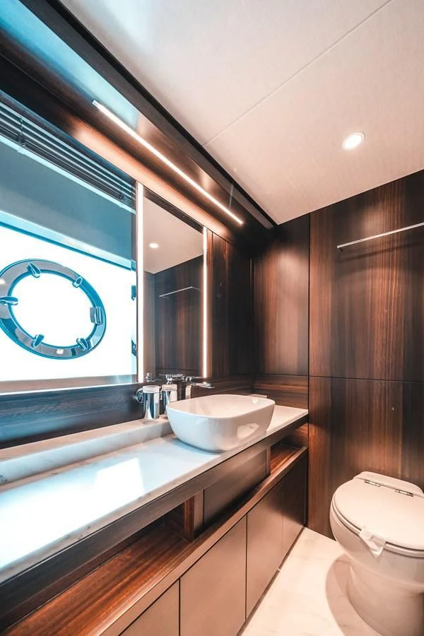 a bathroom with a sink and tub aboard 88 YACHT Yacht for Sale