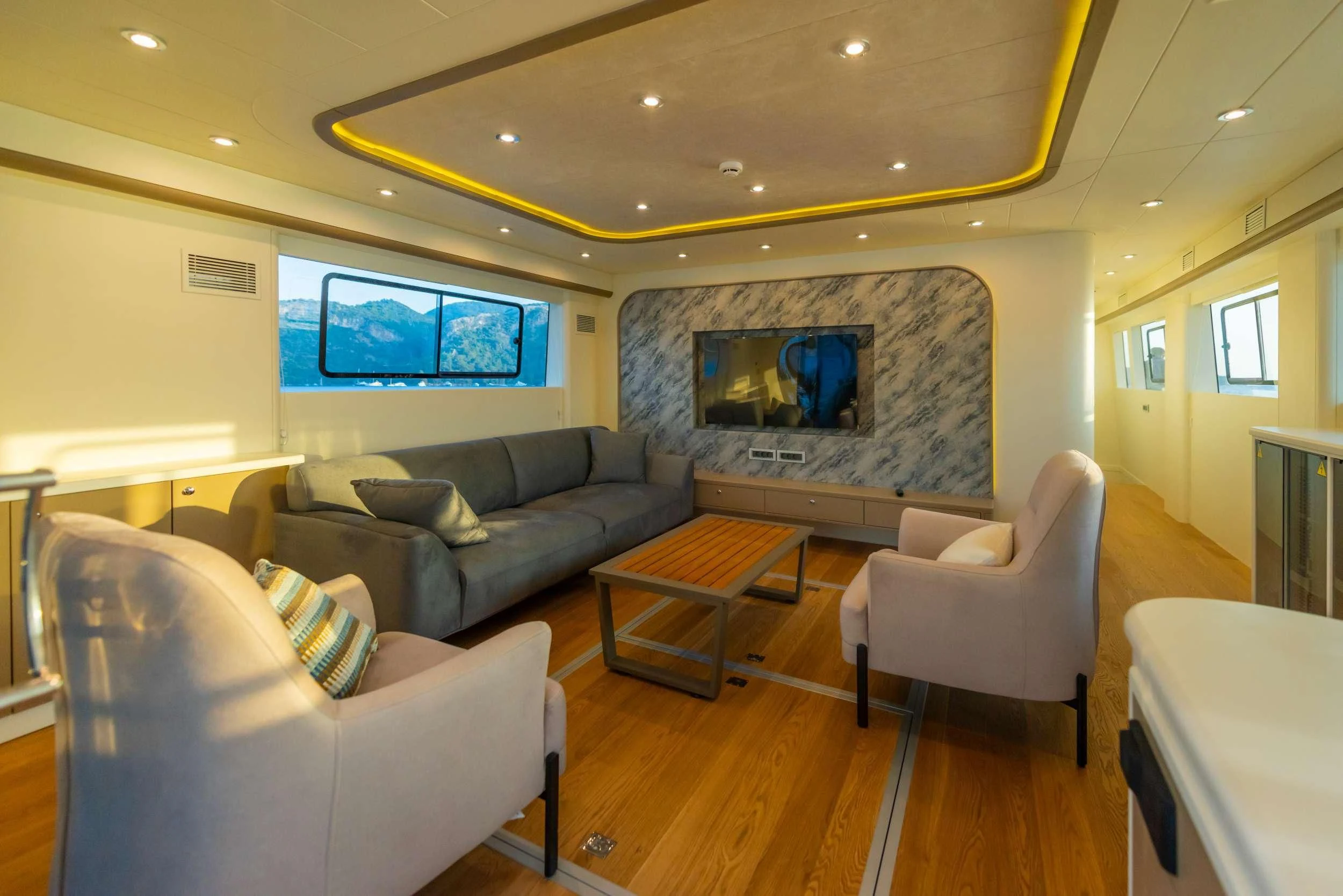 a living room with a large screen aboard 88 YACHT Yacht for Sale
