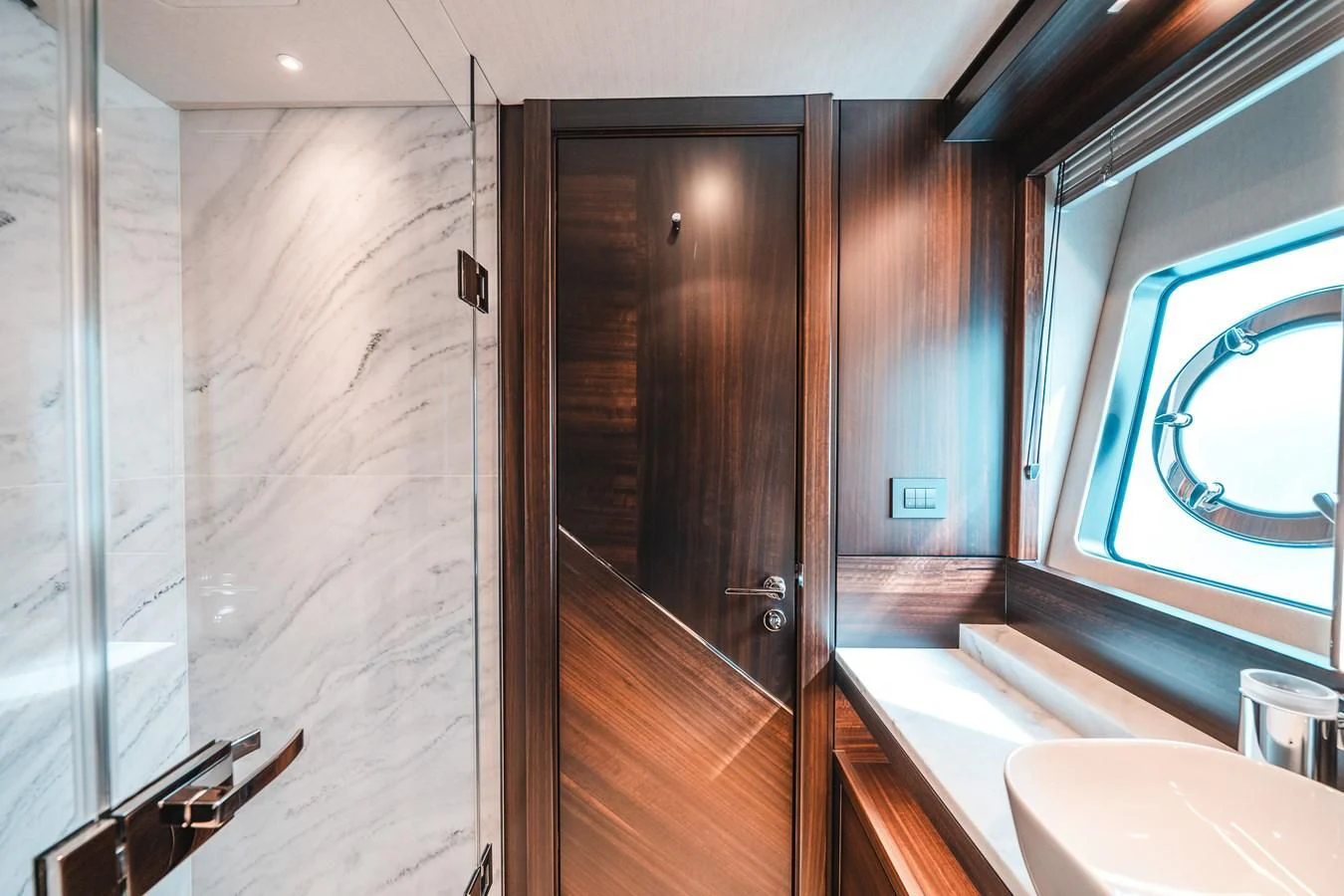 a bathroom with a wood door aboard 88 YACHT Yacht for Sale