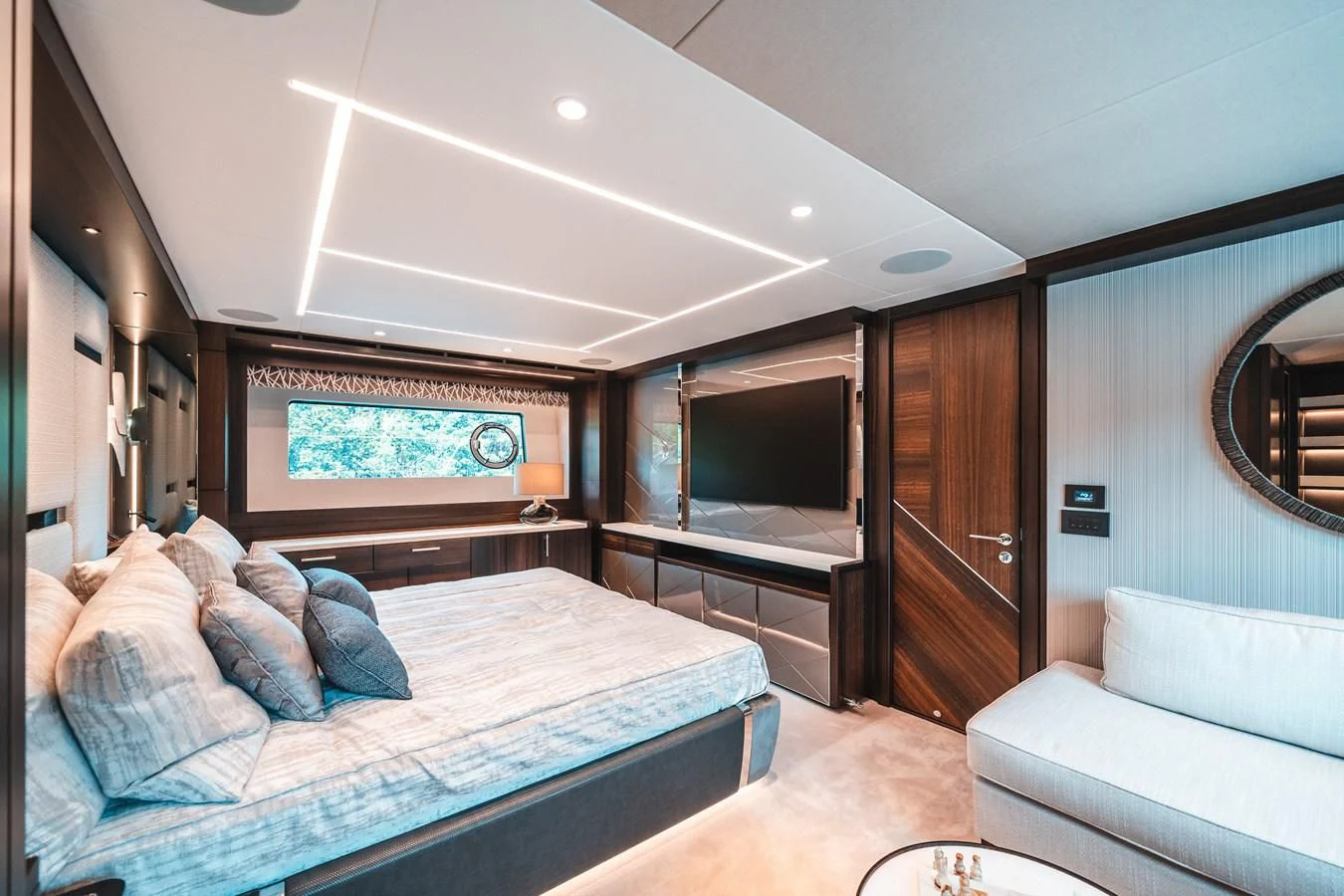 a bedroom with a bed and a television aboard 88 YACHT Yacht for Sale