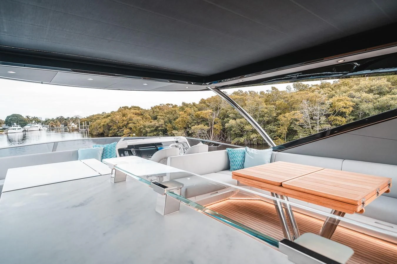 a deck with a view of a city and trees aboard 88 YACHT Yacht for Sale