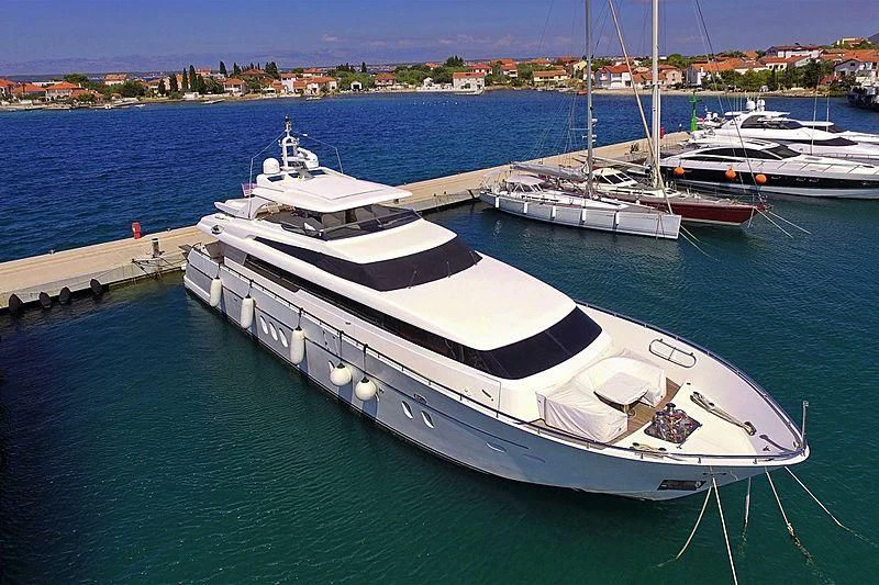 a boat docked at a pier aboard SCARABEUS Yacht for Sale