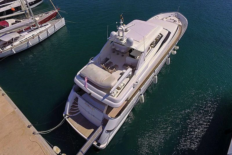 a large ship docked aboard SCARABEUS Yacht for Sale