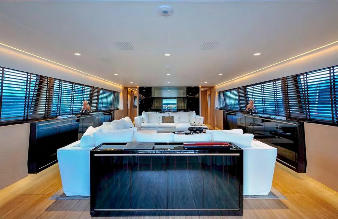 a room with a table and a couch aboard BY BUBANNY Yacht for Sale