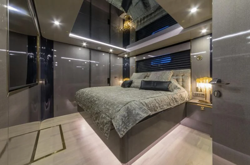 a bed in a room aboard NOAM Yacht for Sale
