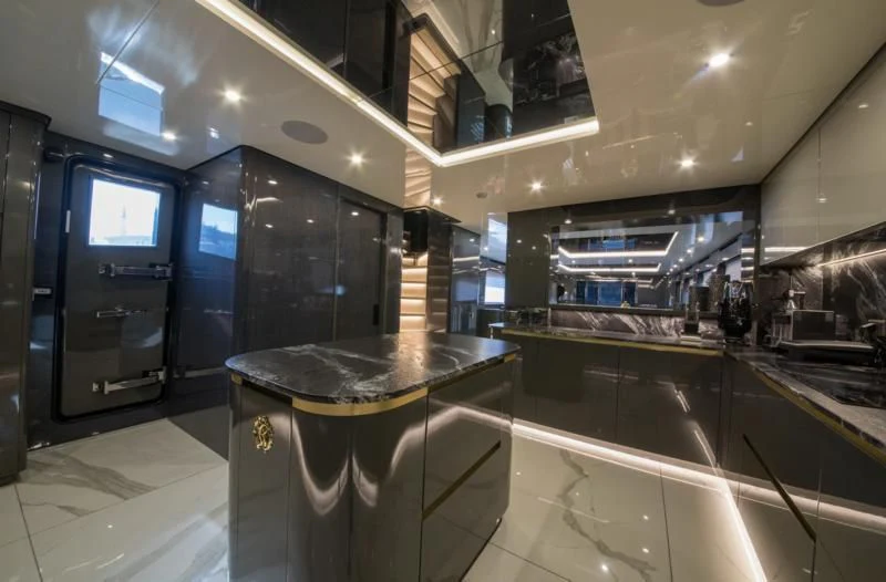 a large kitchen with a glass counter aboard NOAM Yacht for Sale