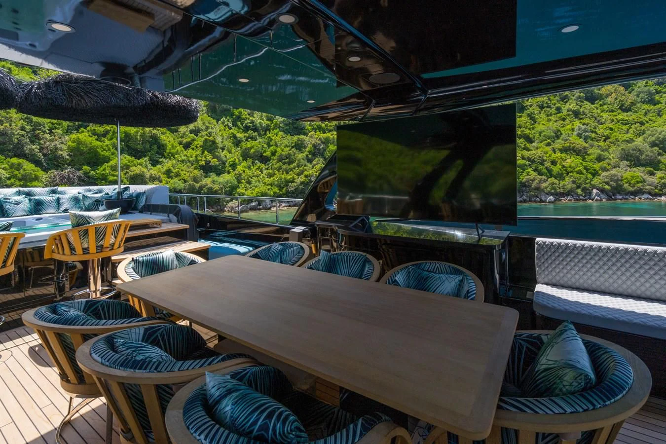 a patio with a table and chairs aboard NOAM Yacht for Sale