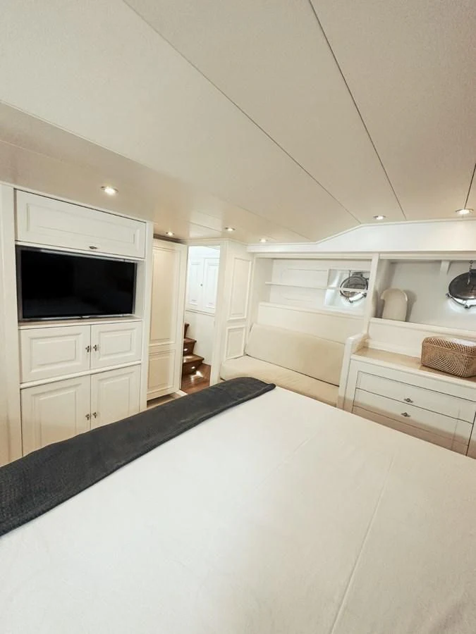 a kitchen with white cabinets aboard LAZIZA Yacht for Sale