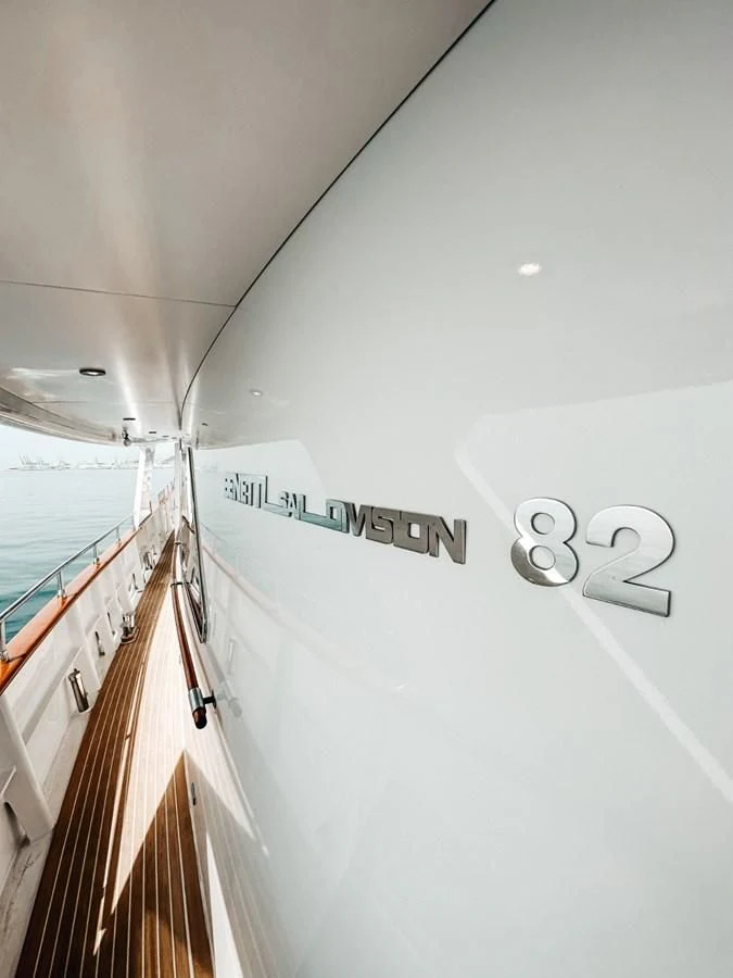 a white boat with a sign on it aboard LAZIZA Yacht for Sale