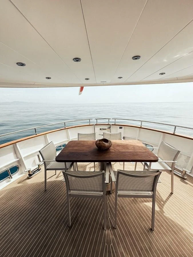 a table and chairs on a boat aboard LAZIZA Yacht for Sale