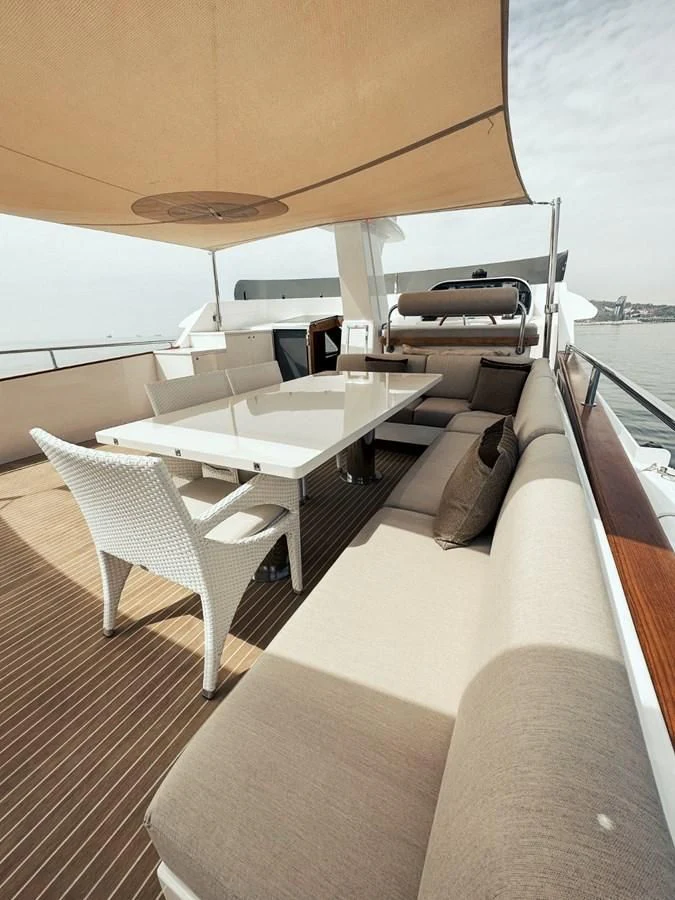 a room with a table and chairs aboard LAZIZA Yacht for Sale