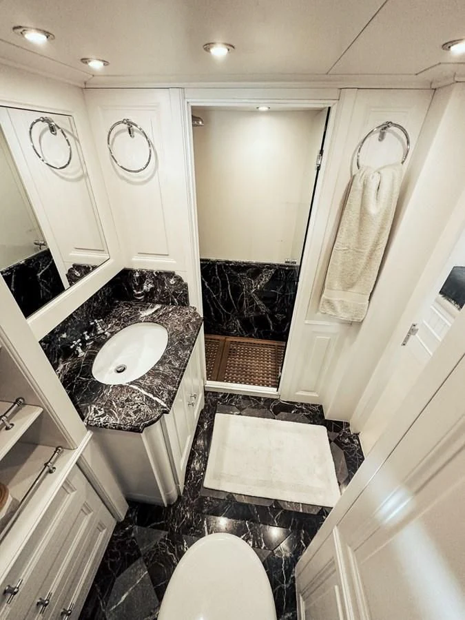 a bathroom with a sink and a toilet aboard LAZIZA Yacht for Sale