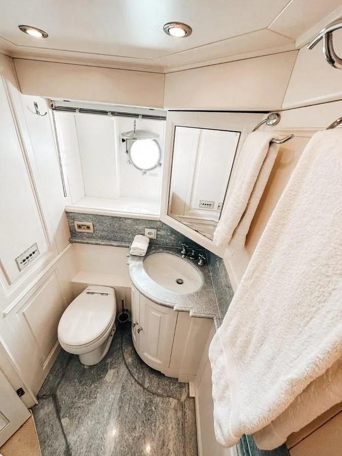 a bathroom with a sink and toilet aboard LAZIZA Yacht for Sale