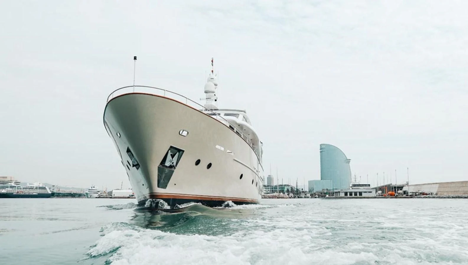 a large ship in the water aboard LAZIZA Yacht for Sale