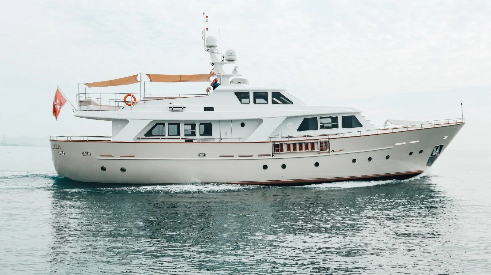 a large white boat in the water aboard LAZIZA Yacht for Sale