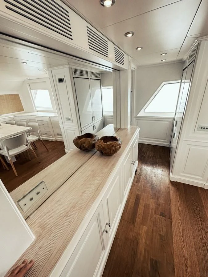 a kitchen with a wood floor aboard LAZIZA Yacht for Sale