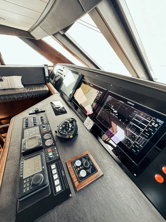 a remote control and a game console on a car aboard LAZIZA Yacht for Sale