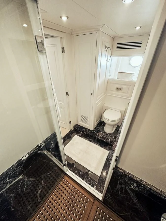 a bathroom with a toilet and a sink aboard LAZIZA Yacht for Sale
