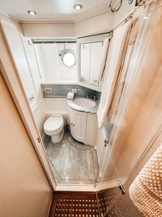 a bathroom with a toilet and sink aboard LAZIZA Yacht for Sale