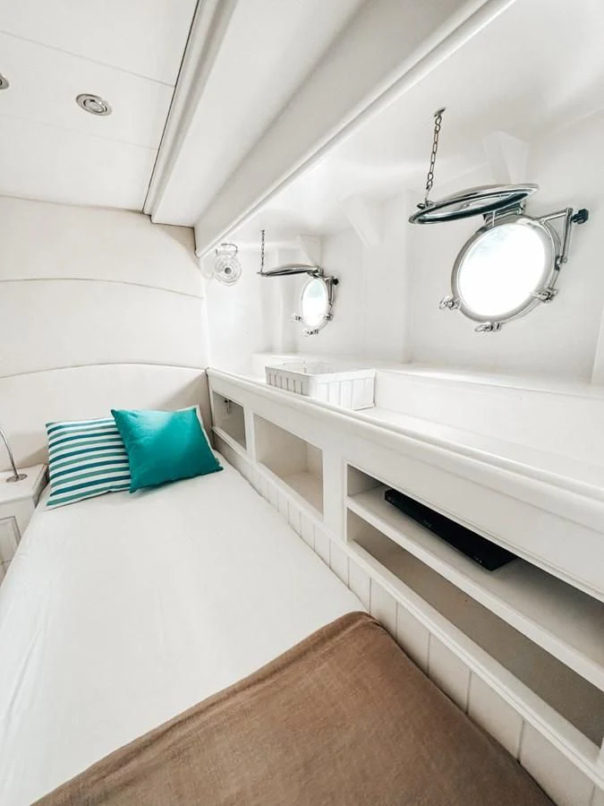 a white bathroom with a tub and a sink aboard LAZIZA Yacht for Sale