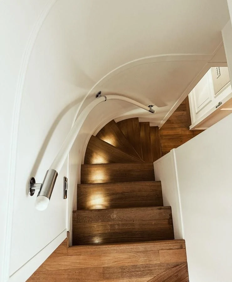 a staircase with a ceiling fan aboard LAZIZA Yacht for Sale