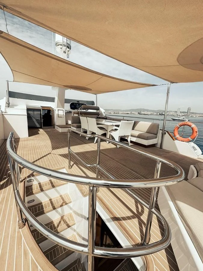 a room with a table and chairs aboard LAZIZA Yacht for Sale