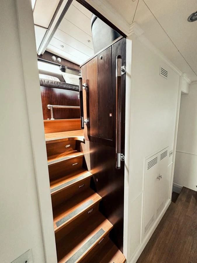 a hallway with a door and a wood door aboard LAZIZA Yacht for Sale