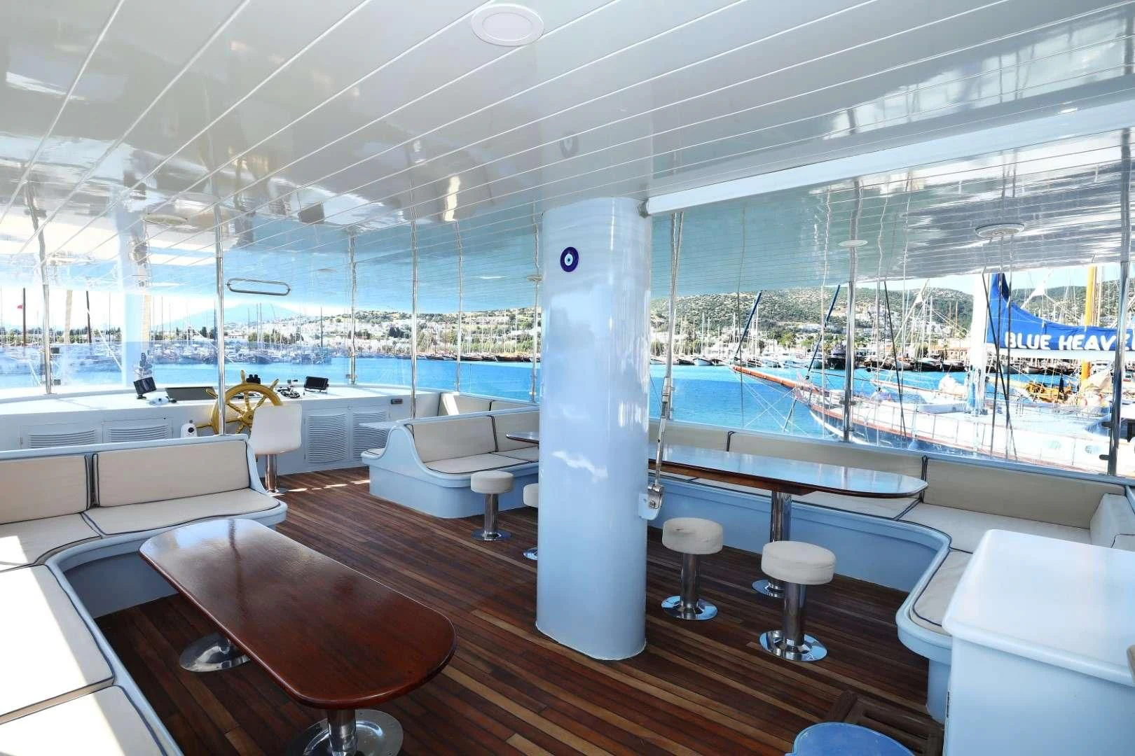 inside of a building with a large window and a large white wall aboard AEGEAN CLIPPER Yacht for Sale
