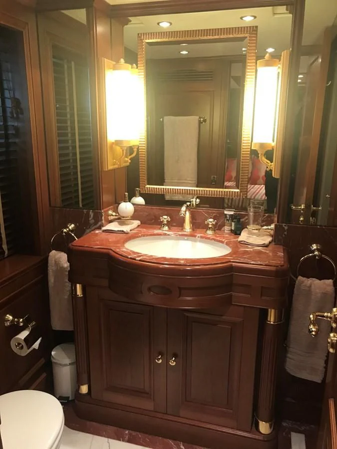 a bathroom with a sink and a mirror aboard LADY ANN Yacht for Sale