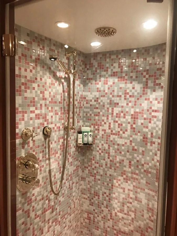 a shower with a tile wall aboard LADY ANN Yacht for Sale