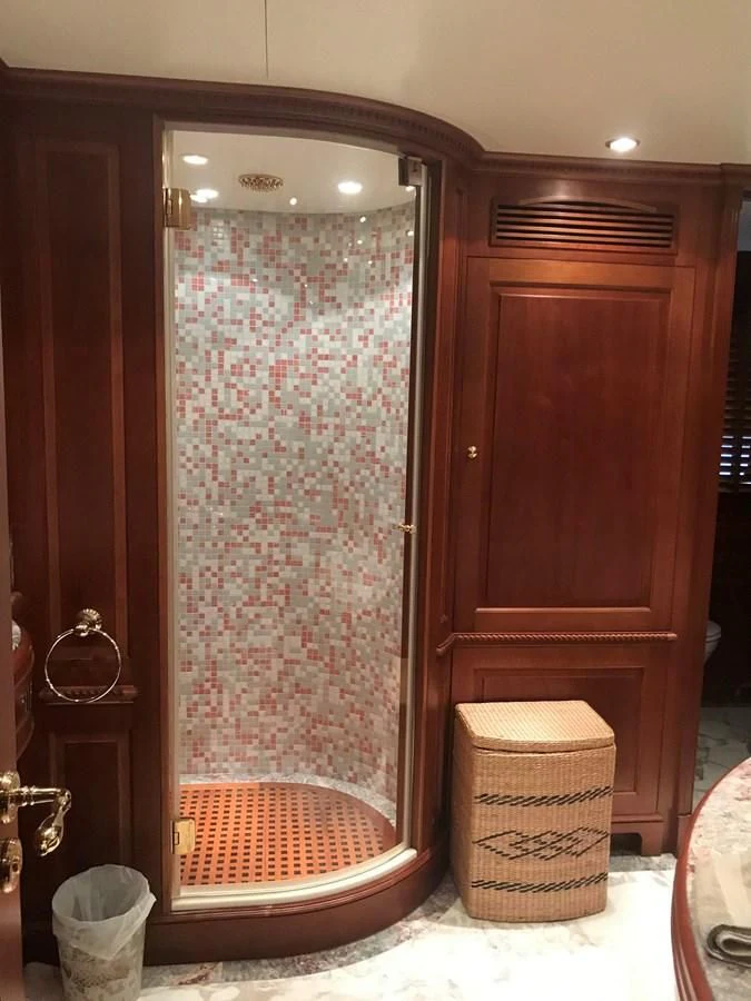 a shower with a wood door aboard LADY ANN Yacht for Sale