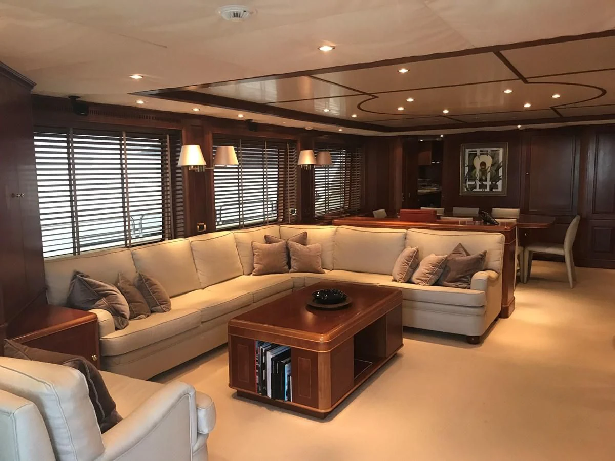 a living room with a couch and a coffee table aboard LADY ANN Yacht for Sale