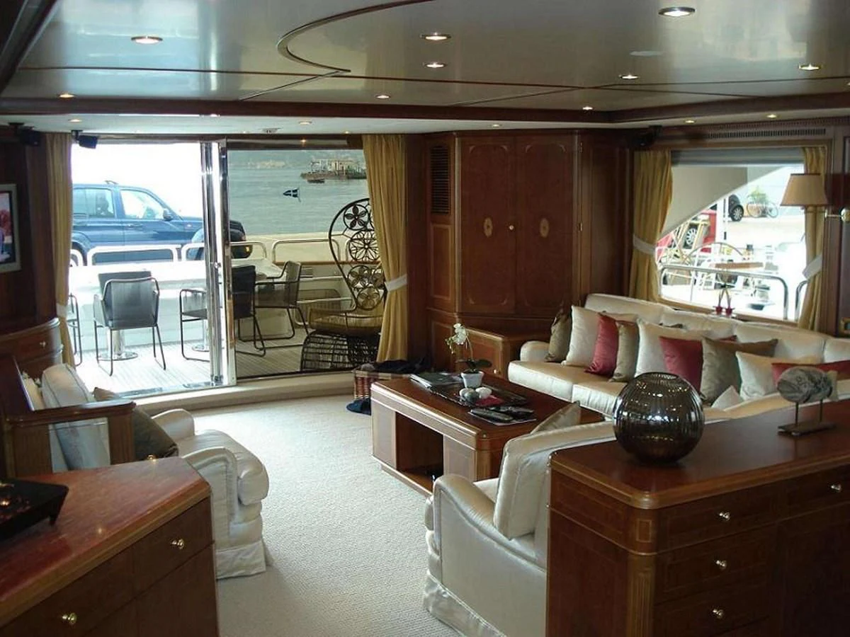 a living room with a large glass door aboard LADY ANN Yacht for Sale